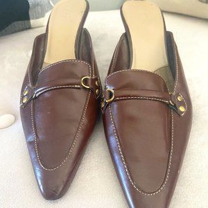 Slip ons with a low heel.  Brown sleek design, size 10